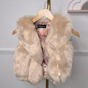 Fashionable girl faux fur and faux leather flesh pink vest